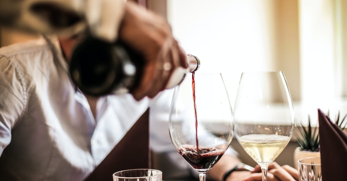 Catering event for BBQ for 30 people. [duplicate] - Crop man pouring red wine in glass in restaurant