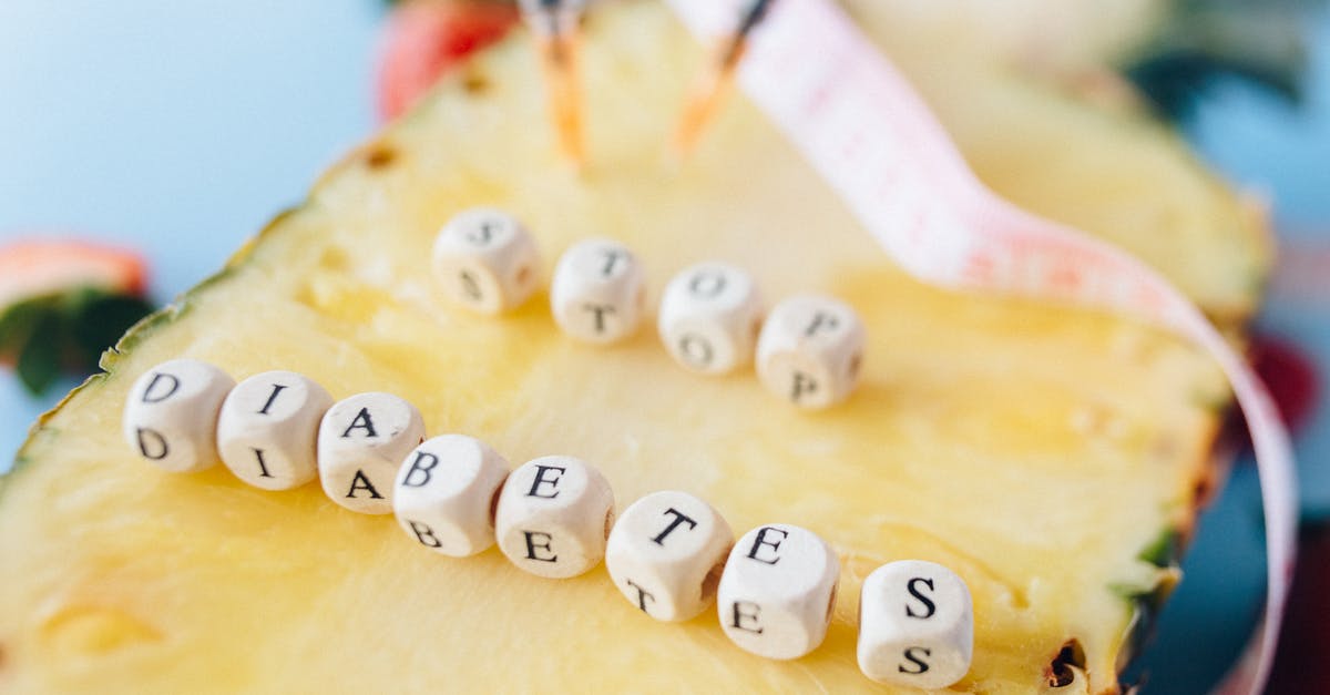 Cause of Spoiled idli? - Letter Dices over a Cut Pineapple Fruit