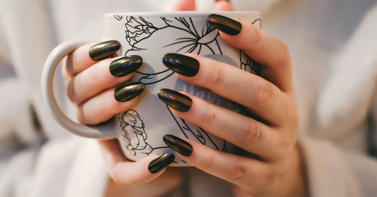 Ceramic Coffee mug measurement - Woman With Black Manicure Holding White and Grey Floral Ceramic Cup Ceramic Coffee mug measurement - Woman With Black Manicure Holding White and Grey Floral Ceramic Cup