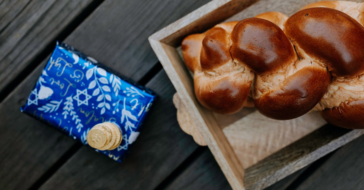 Challah bread -- too crusty? - Photo Of Bread On Wooden Tray Beside A Gift Box Challah bread -- too crusty? - Photo Of Bread On Wooden Tray Beside A Gift Box