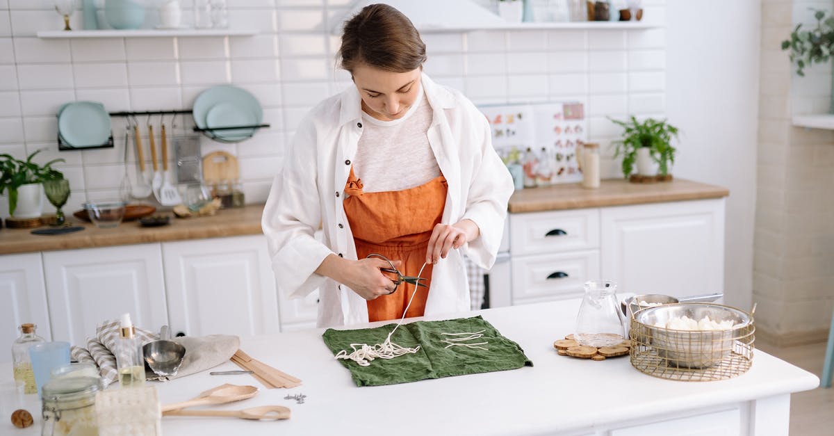 Cheese Cutting Tools - A Woman Cutting Candle Wicks with Scissors Cheese Cutting Tools - A Woman Cutting Candle Wicks with Scissors