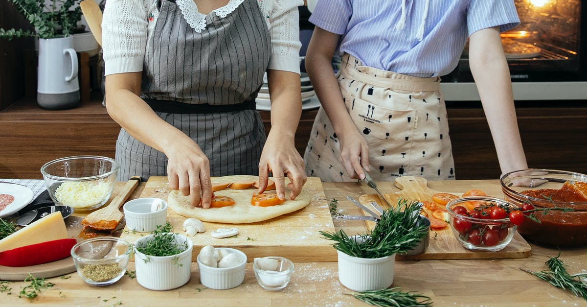 Cheese sauce without flour? - Crop women cooking pizza together Cheese sauce without flour? - Crop women cooking pizza together
