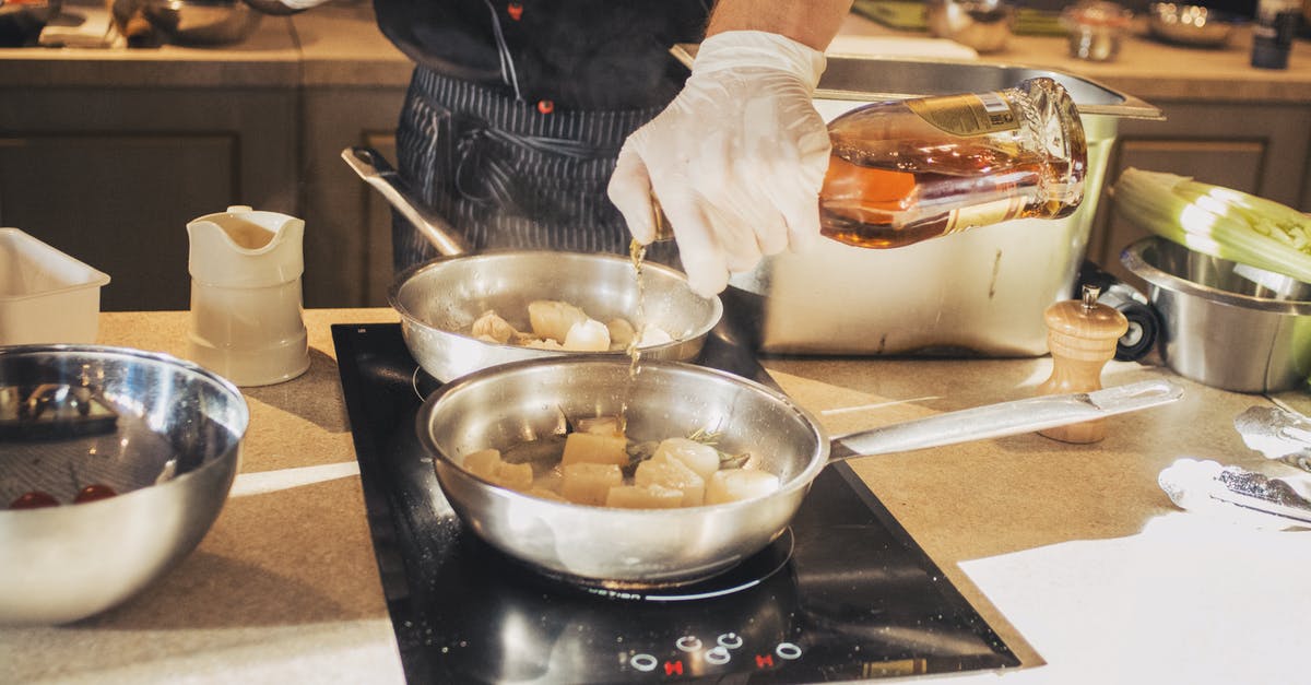 Chef at restaurant seemed to be using really flimsy pans - Photo Of Person Holding Bottle Chef at restaurant seemed to be using really flimsy pans - Photo Of Person Holding Bottle