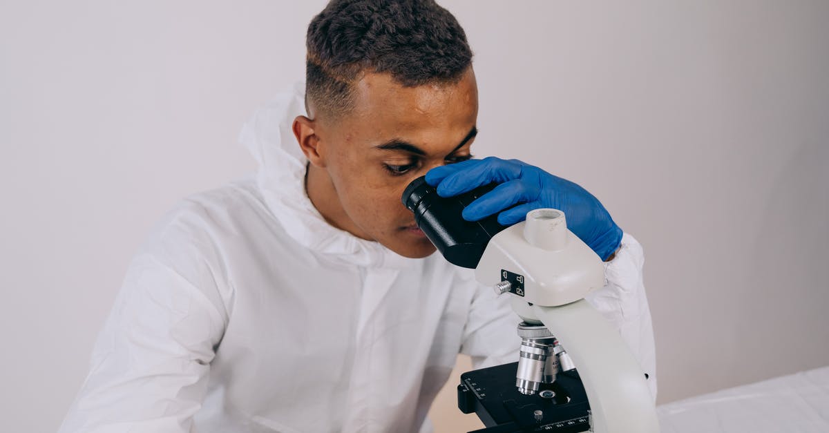Chemistry of maple butter - Man in White Dress Shirt Using White and Gray Sewing Machine