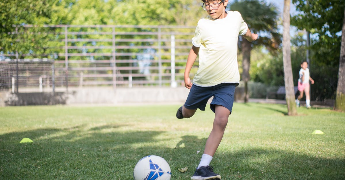 Chili with bitter aftertaste and not enough kick - Boy in White T-shirt and Black Shorts Playing Soccer