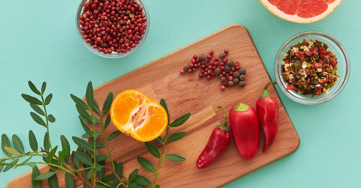 Chili with bitter aftertaste and not enough kick - Sliced Lemon Beside Red Chili and Red Chili on Brown Wooden Chopping Board