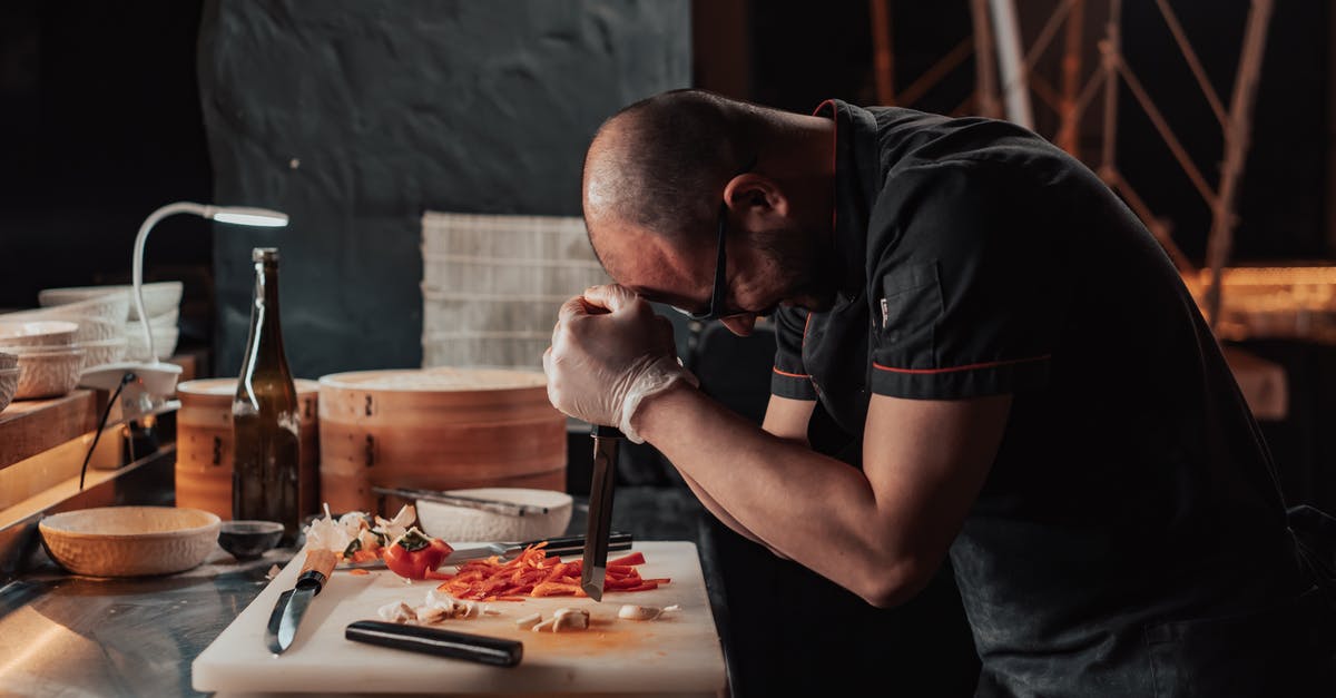 Chinese cooking wine varieties - Man in Black T-shirt Sitting at Table Chinese cooking wine varieties - Man in Black T-shirt Sitting at Table