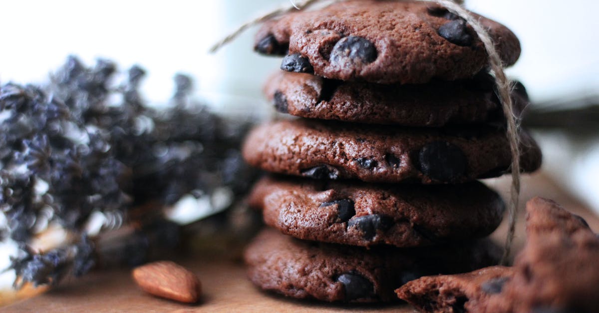 Chocolate choux pastry - Brown Cookies on Brown Wooden Table Chocolate choux pastry - Brown Cookies on Brown Wooden Table