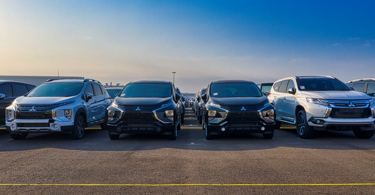 Choice of new seasonable cookware (iron/carbon steel, pan/wok) - Modern SUV cars parked in row