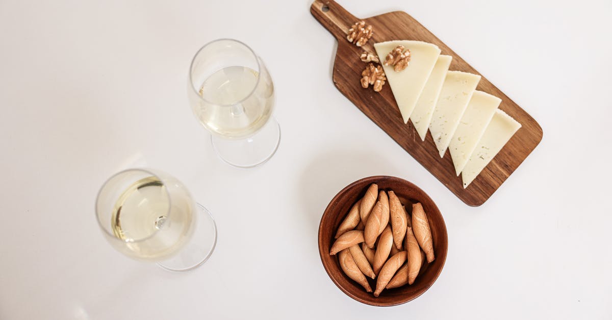 Chop nuts before or after toasting? - Overhead Shot of Glasses of Wine and Cheese Slices Chop nuts before or after toasting? - Overhead Shot of Glasses of Wine and Cheese Slices