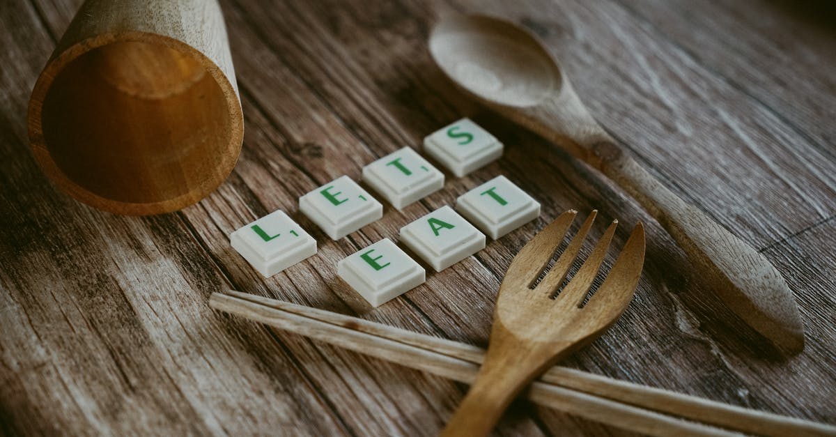 Chopsticks versus forks? - Wooden Fork and Spoon with Cup Near Chopsticks Chopsticks versus forks? - Wooden Fork and Spoon with Cup Near Chopsticks