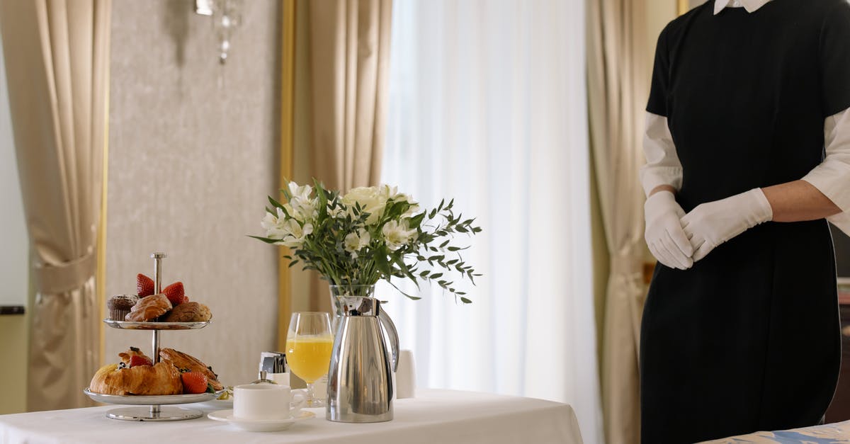 choux pastry, keep mixing while waiting for the roux to cool? - Woman Standing Near the Table with Pastries choux pastry, keep mixing while waiting for the roux to cool? - Woman Standing Near the Table with Pastries