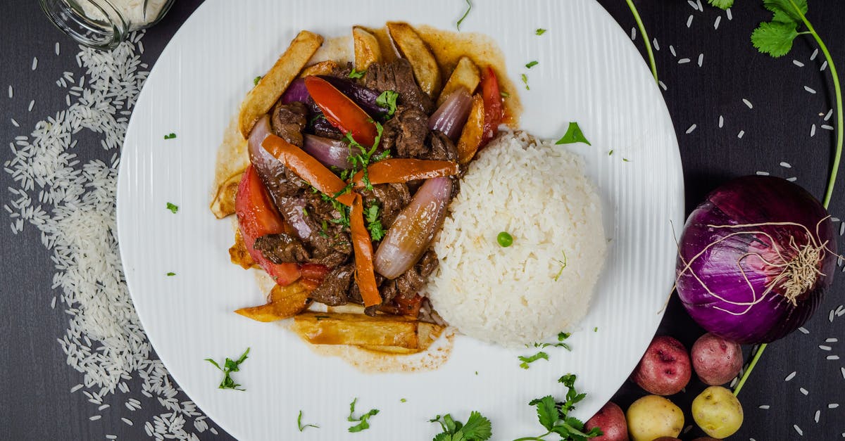 Chuck Roast, Beef Broth, Onion and Potato. Can this work? - A Mouthwatering Dish on a Ceramic Plate Surrounded by Vegetables on the Table Chuck Roast, Beef Broth, Onion and Potato. Can this work? - A Mouthwatering Dish on a Ceramic Plate Surrounded by Vegetables on the Table