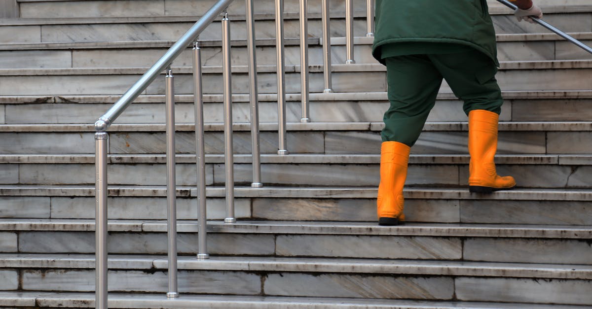 Cleaning burnt-on grease with ammonia - Person in Green Jacket and Brown Pants Walking on Gray Concrete Stairs Cleaning burnt-on grease with ammonia - Person in Green Jacket and Brown Pants Walking on Gray Concrete Stairs