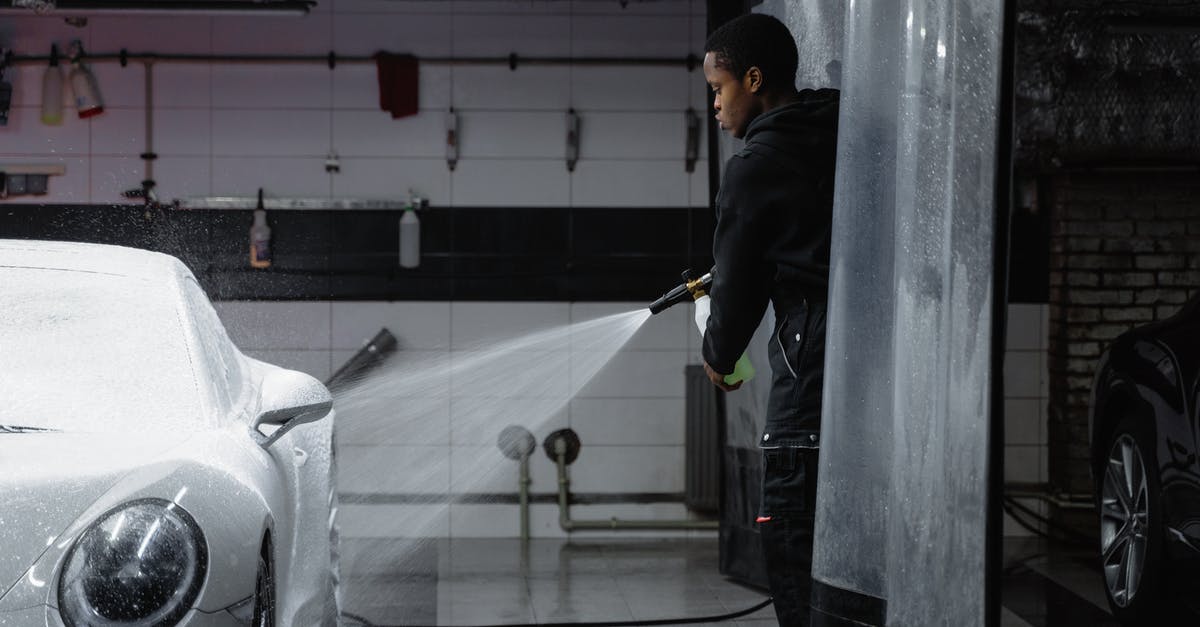 Cleaning pressure cookers advice - Man in Black Jacket Washing the White Car Using a Washer Pressure Hose Cleaning pressure cookers advice - Man in Black Jacket Washing the White Car Using a Washer Pressure Hose