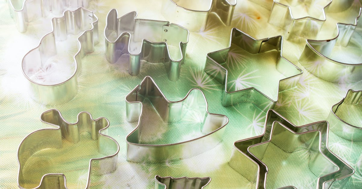 Cleaning silver with aluminum - Assorted-shape Stainless Steel Cookie Cutters on Green Surface