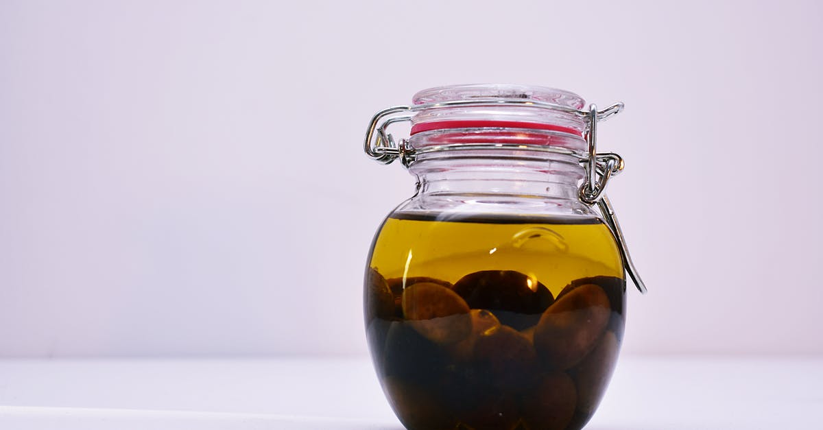 Close the lid of unsealed jar with pop-up lid - Clear Airtight Canister With Brown Liquid Close the lid of unsealed jar with pop-up lid - Clear Airtight Canister With Brown Liquid
