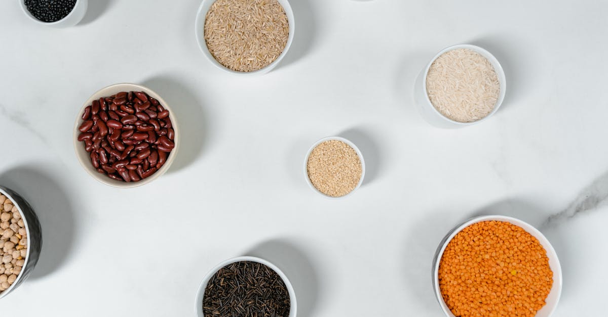 Cloves vs. Nutmeg in Chili Recipe - Brown and White Round Containers