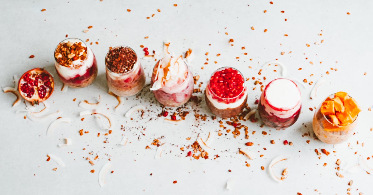 Coconut cream from coconut butter - Fruits Toppings Over Shakes in Glasses Coconut cream from coconut butter - Fruits Toppings Over Shakes in Glasses