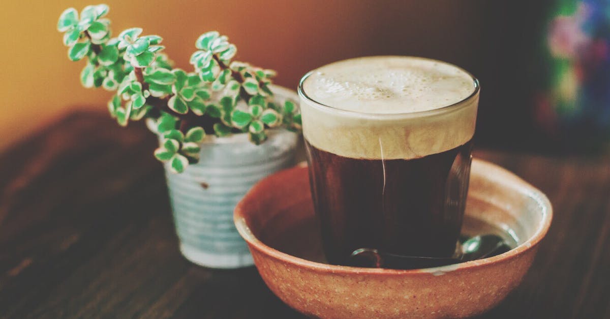 Coffee foam vs. Tea foam - Photograph of a Glass of Drink Coffee foam vs. Tea foam - Photograph of a Glass of Drink
