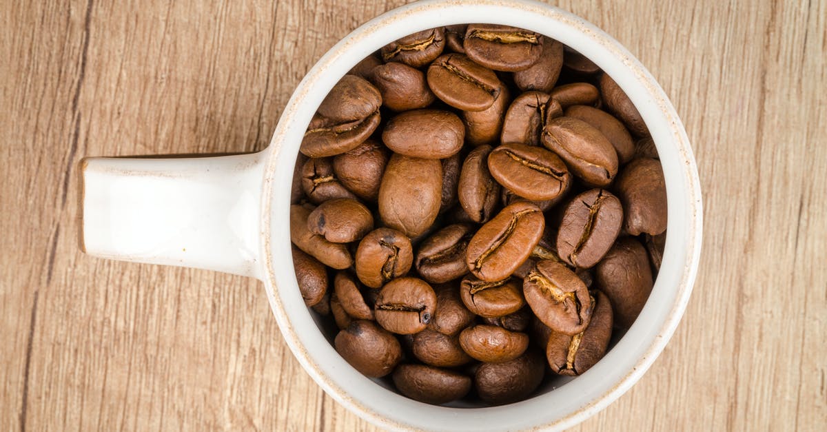 Coffee roasting, worth upgrade from popcorn popper - Roasted Coffee Beans Inside White Ceramic Mug Coffee roasting, worth upgrade from popcorn popper - Roasted Coffee Beans Inside White Ceramic Mug