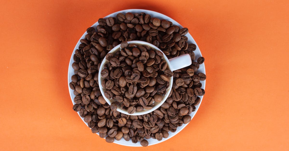 Coffee roasting, worth upgrade from popcorn popper - Coffee Beans in Cup Coffee roasting, worth upgrade from popcorn popper - Coffee Beans in Cup