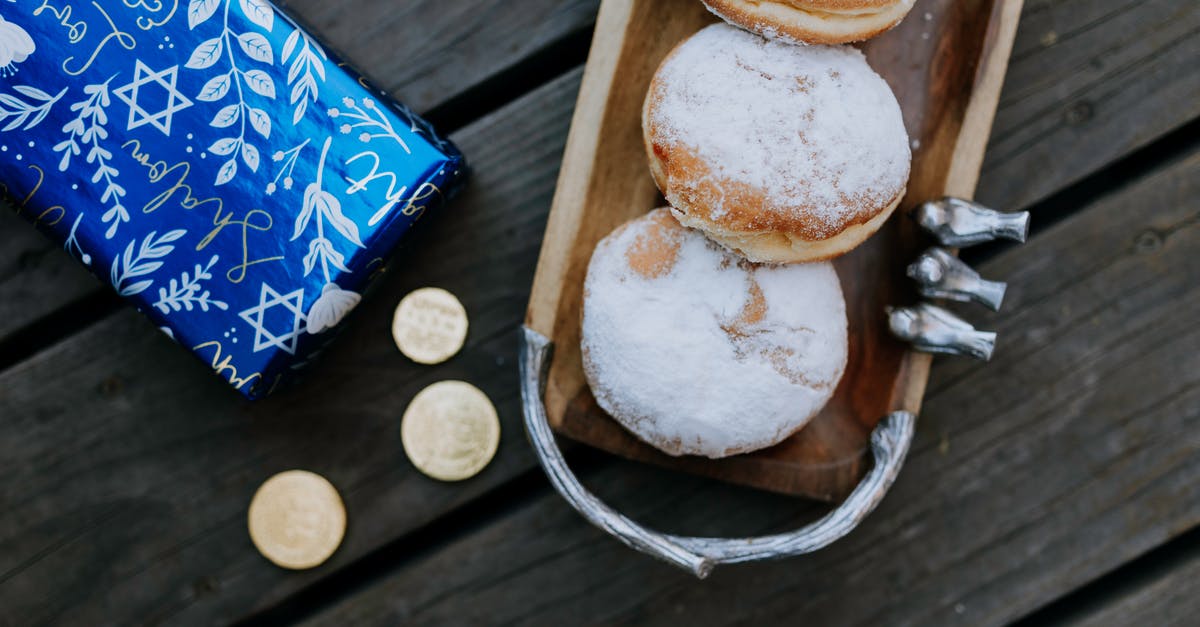 Coins in bread? - Photo Of Doughnuts On Top Of Wooden Table Coins in bread? - Photo Of Doughnuts On Top Of Wooden Table