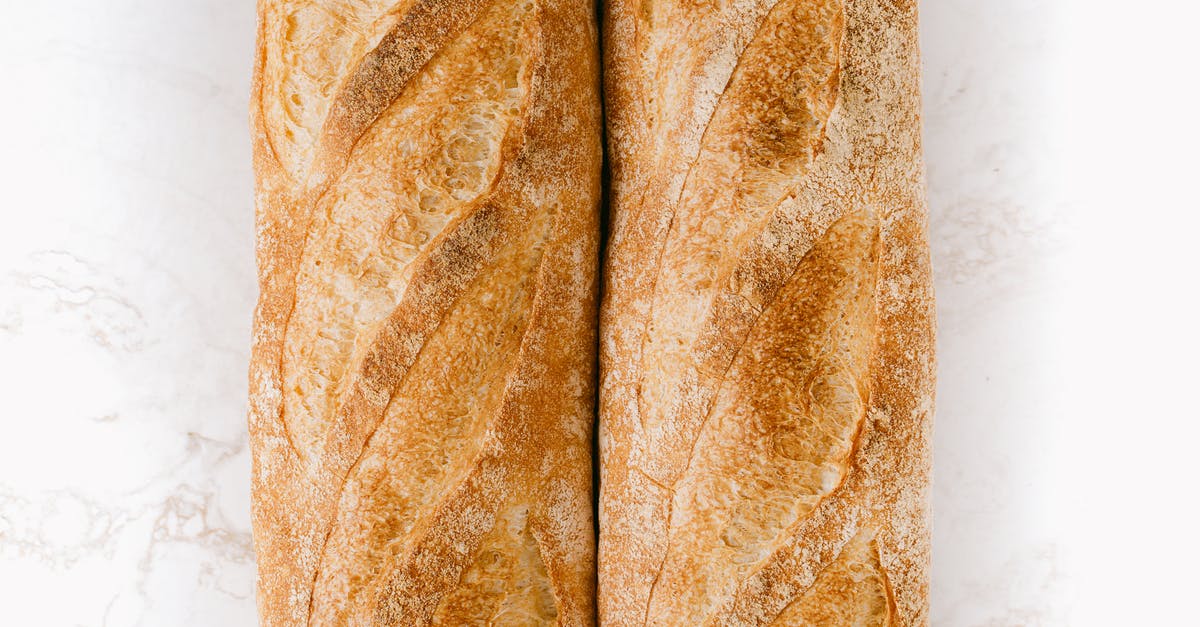 Commercial part-baked baguettes - Top View of Baguettes on Marble Surface Commercial part-baked baguettes - Top View of Baguettes on Marble Surface