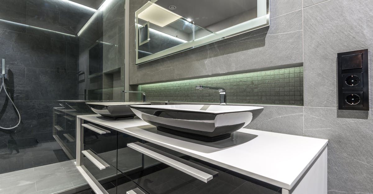 Compact steel toaster ovens without glass? - Stainless Steel Faucet on White Ceramic Sink