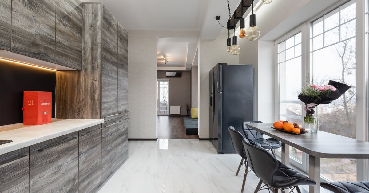 Condensation inside packed, refrigerated food - Interior of modern kitchen with window Condensation inside packed, refrigerated food - Interior of modern kitchen with window
