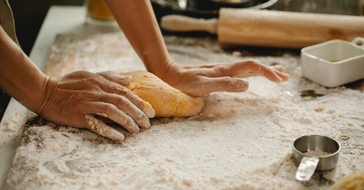 Converting bread recipes for an overnight rise? - Woman making pastry on table with flour