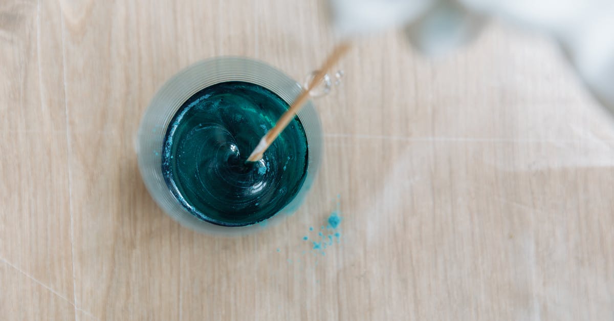 Converting stand mixing time to hand mixing - Close-Up Shot of a Person Mixing a Turquoise Paint Converting stand mixing time to hand mixing - Close-Up Shot of a Person Mixing a Turquoise Paint