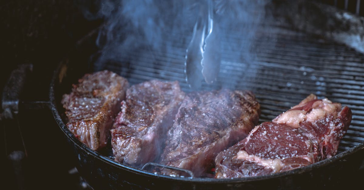 Cooking a tender pork sirloin (Solomillo al Whisky) - Grilled Meat on Black Pan