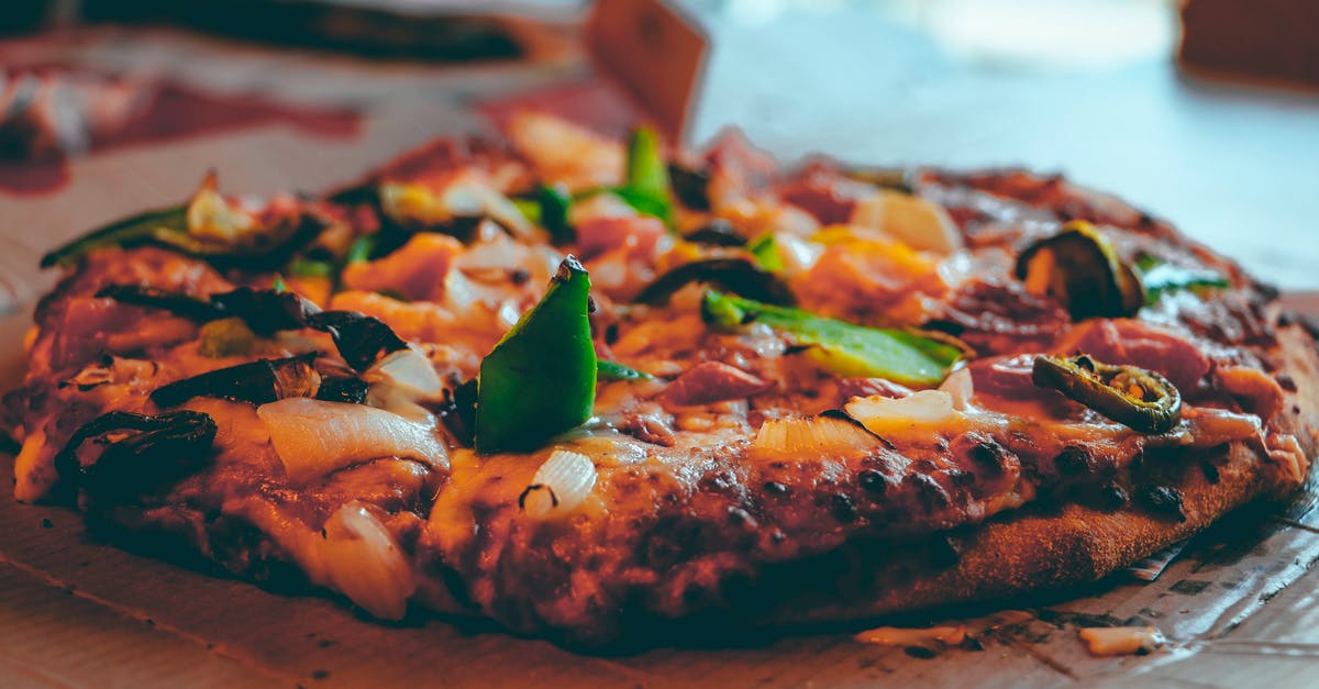 Cooking a whole 30lb sturgeon on a spit - Selective Focus Photography of Baked Pizza Cooking a whole 30lb sturgeon on a spit - Selective Focus Photography of Baked Pizza