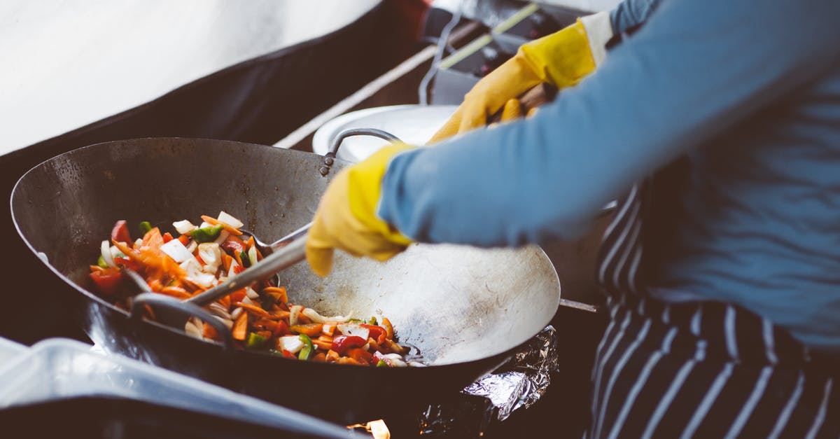 cooking canned veggies in a Korean clay pot? - Person Cooking on Stainless Steel Cooking Pot cooking canned veggies in a Korean clay pot? - Person Cooking on Stainless Steel Cooking Pot