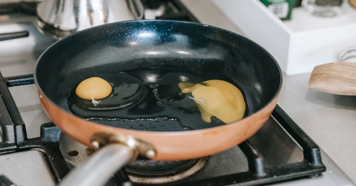Cooking Chicken in Cooker Versus Pan? - Eggs frying in pan on stove Cooking Chicken in Cooker Versus Pan? - Eggs frying in pan on stove