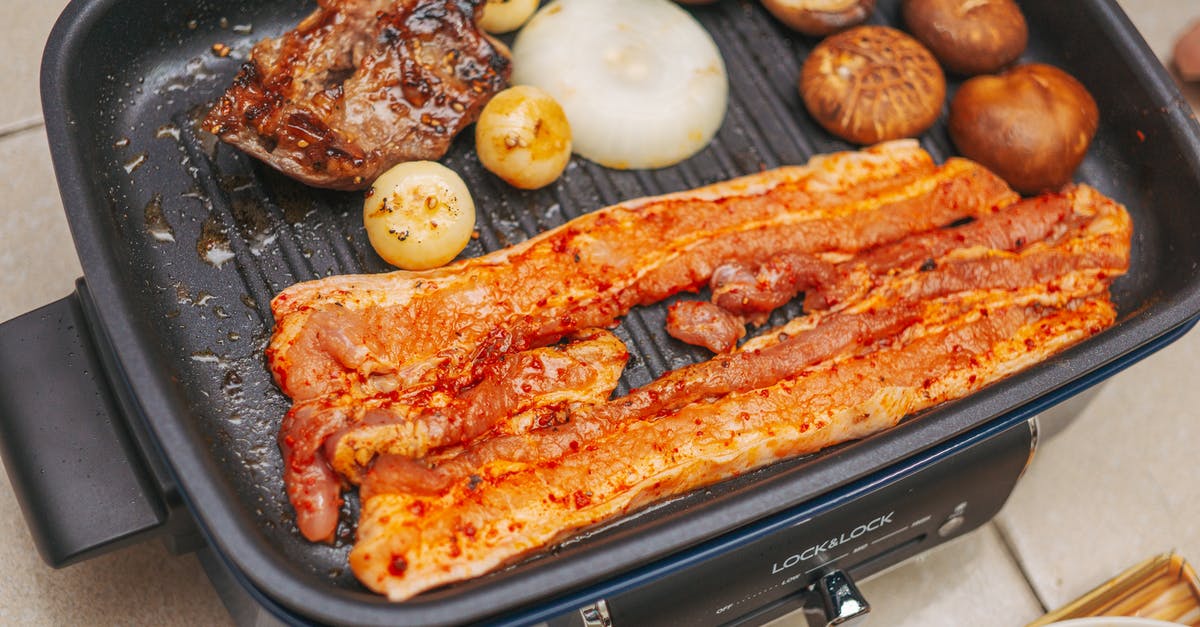 Cooking Chicken in Cooker Versus Pan? - Strips of Pork and a Piece of Chicken on Electric Griller with Onions and Mushrooms Cooking Chicken in Cooker Versus Pan? - Strips of Pork and a Piece of Chicken on Electric Griller with Onions and Mushrooms