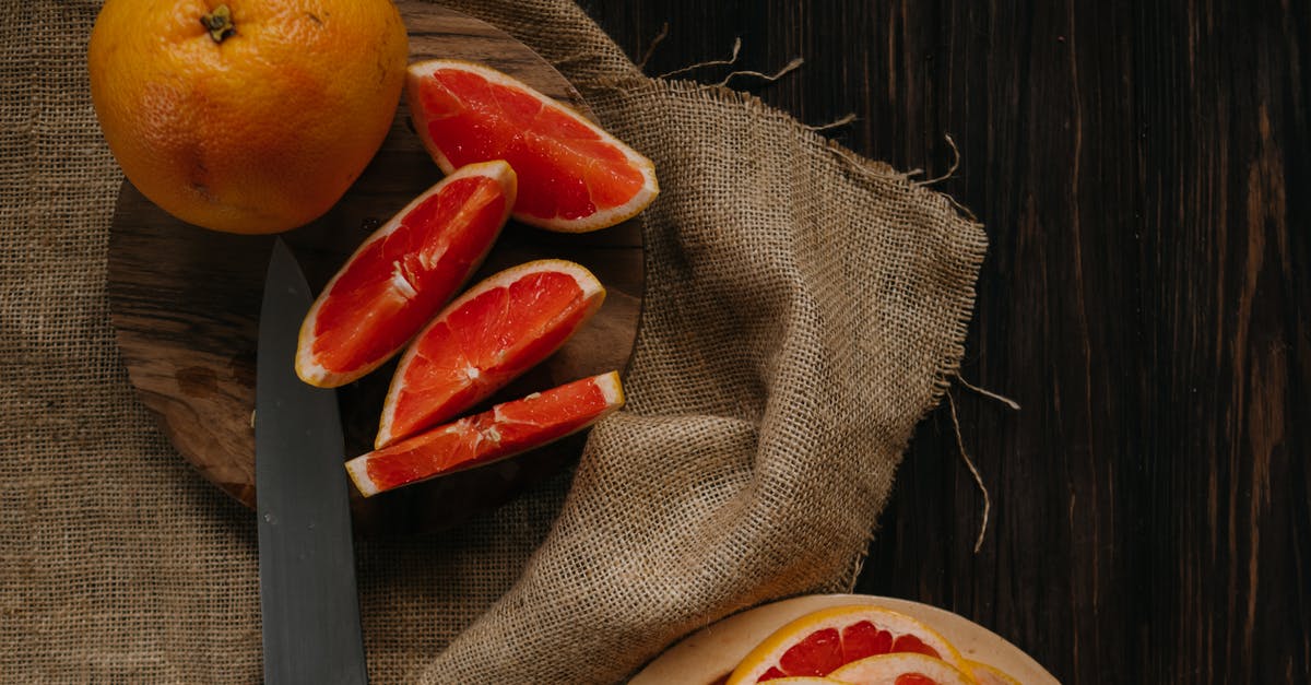 Cooking lemon juice into stew - Sliced Orange Fruit on Brown Textile Cooking lemon juice into stew - Sliced Orange Fruit on Brown Textile