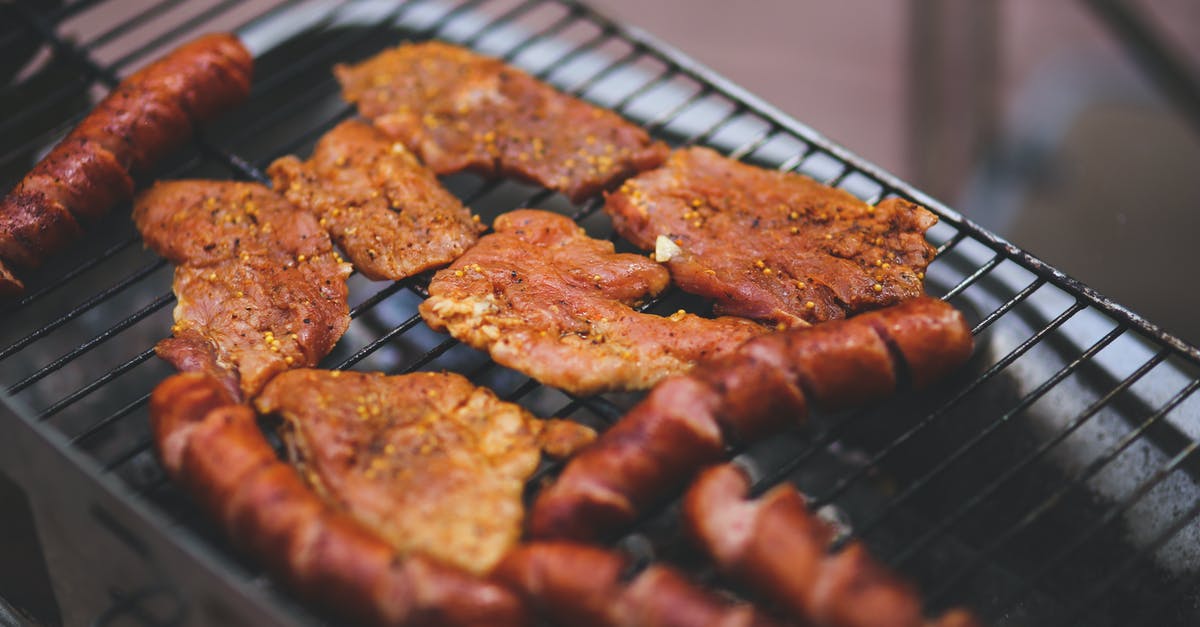 Cooking schnitzel without thinning it - Pork and sausage on the grill Cooking schnitzel without thinning it - Pork and sausage on the grill
