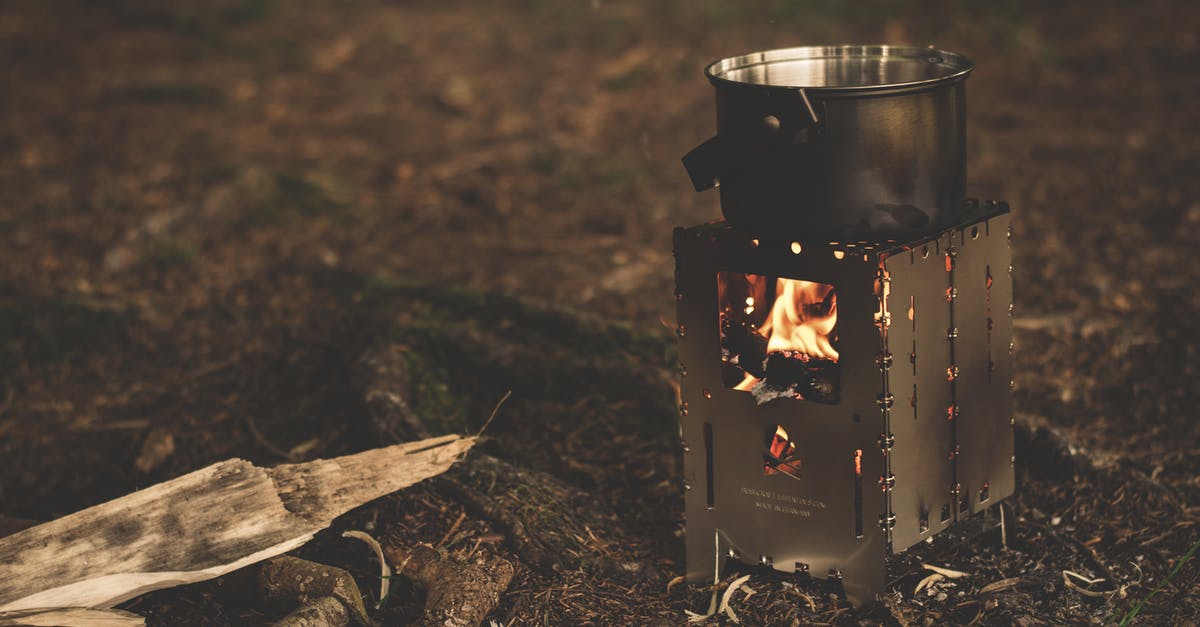Cooking stove vs cooking on open camp fire - Stainless Steel Pot on Brown Wood Stove Outside during Night Time Cooking stove vs cooking on open camp fire - Stainless Steel Pot on Brown Wood Stove Outside during Night Time