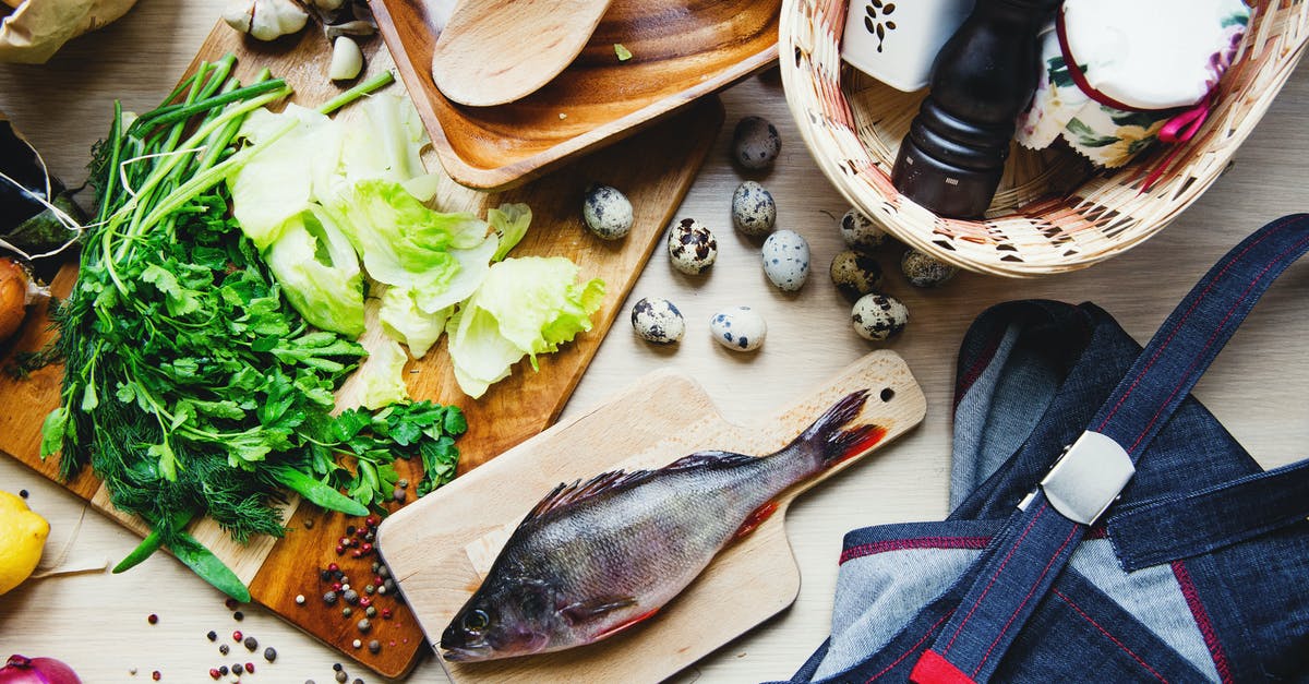 Cooking thawed fish when it says cook from frozen? - Top view of fresh fish and vegetables put on cutting board near wooden dishware and wicker basket with pepper shaker and jar in kitchen Cooking thawed fish when it says cook from frozen? - Top view of fresh fish and vegetables put on cutting board near wooden dishware and wicker basket with pepper shaker and jar in kitchen