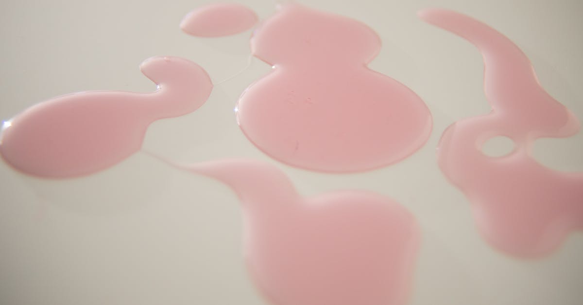 Cooking through thick liquids - Abstract backdrop of gel drops on white surface Cooking through thick liquids - Abstract backdrop of gel drops on white surface