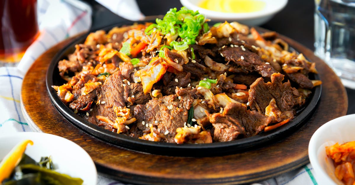 Cooking time adjustment for large quantities of stew - Cooked Meat on Plate Cooking time adjustment for large quantities of stew - Cooked Meat on Plate