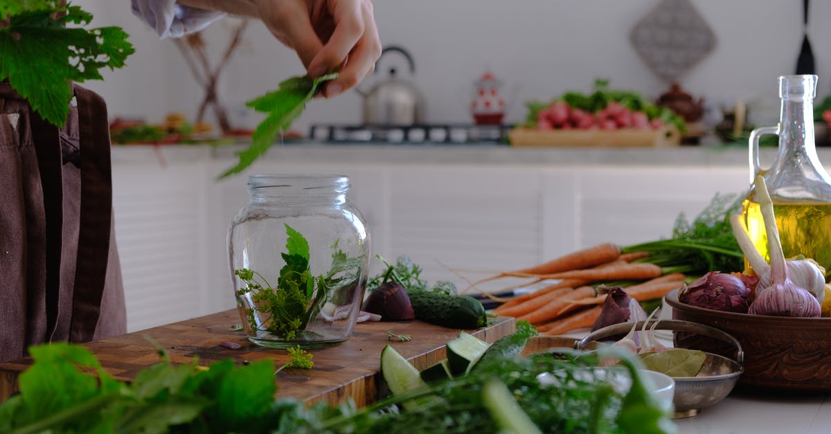 cooking vegetables for mashing - Person Putting Vegetable Leaves in Clear Glass Jar cooking vegetables for mashing - Person Putting Vegetable Leaves in Clear Glass Jar