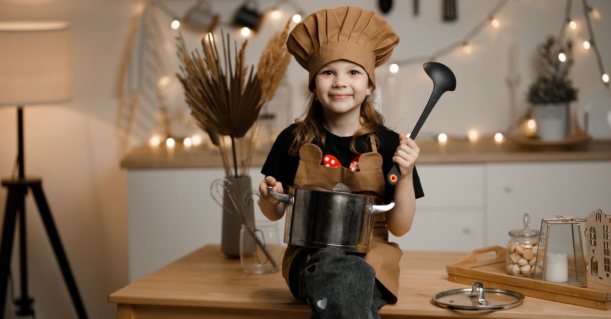 Cooking with a crock pot - temp - Little Girl Dressed as a Chef Sitting on a Kitchen Counter Holding a Pot and a Soup Spoon Cooking with a crock pot - temp - Little Girl Dressed as a Chef Sitting on a Kitchen Counter Holding a Pot and a Soup Spoon