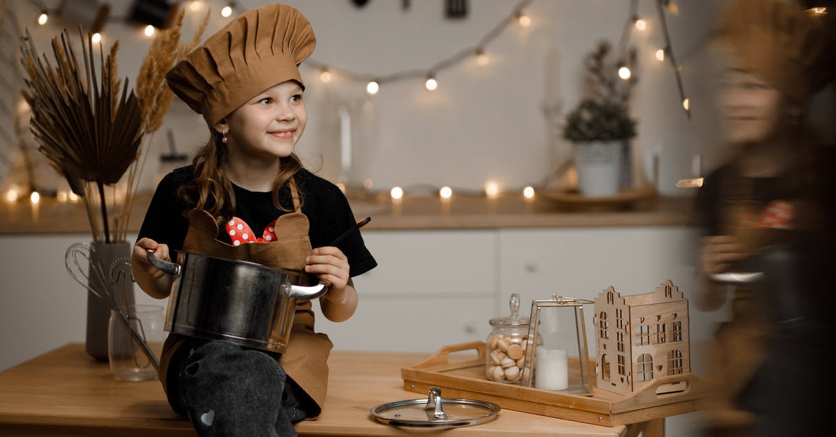 Cooking with a crock pot - temp - Little Girl Dressed as a Chef Sitting on a Kitchen Counter Holding a Pot and a Soup Spoon Cooking with a crock pot - temp - Little Girl Dressed as a Chef Sitting on a Kitchen Counter Holding a Pot and a Soup Spoon