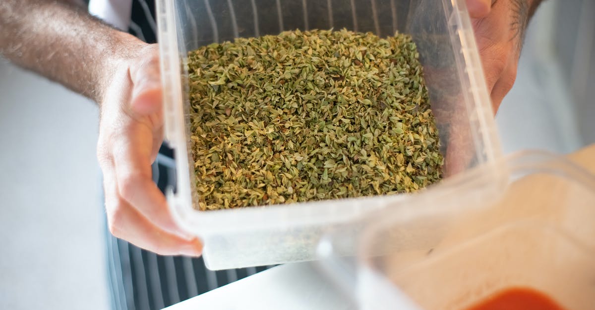 Cooking with Plastic [duplicate] - Man Holding Plastic Container with Herbs