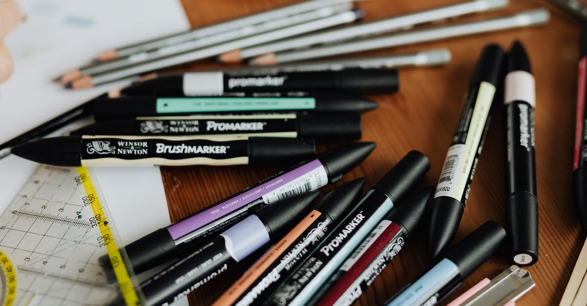 Cooling multiple items on a sheet pan rack - Scattered stationery of colourful drawing markers and pencils on working table of architect Cooling multiple items on a sheet pan rack - Scattered stationery of colourful drawing markers and pencils on working table of architect