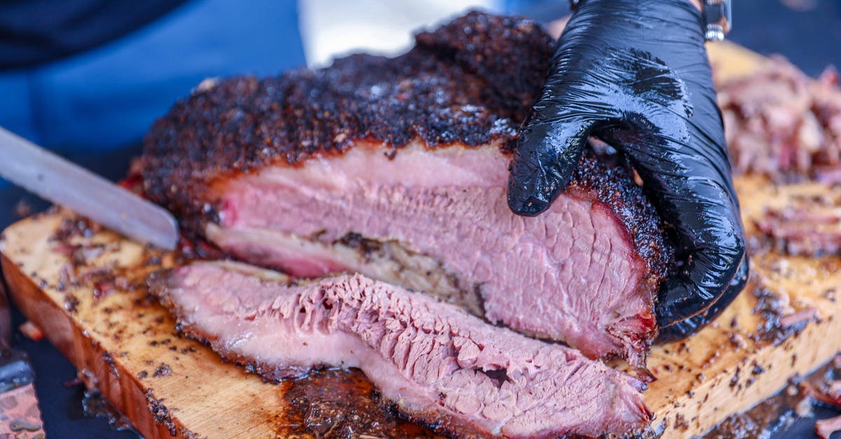 Corned Beef Brisket left out [duplicate] - A Person Slicing Barbecue Beef Brisket