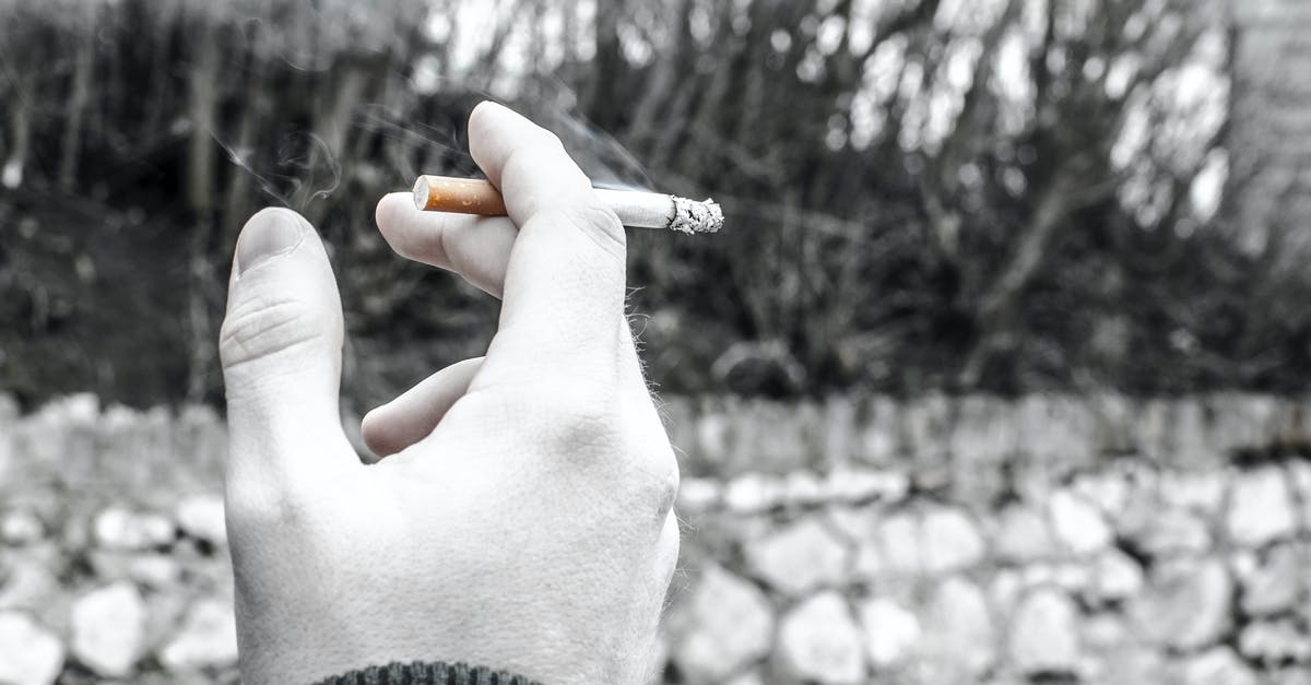 Could it be bad black olive that I've eaten? - Selective Color Photography of Person Holding Cigarette Stick Could it be bad black olive that I've eaten? - Selective Color Photography of Person Holding Cigarette Stick